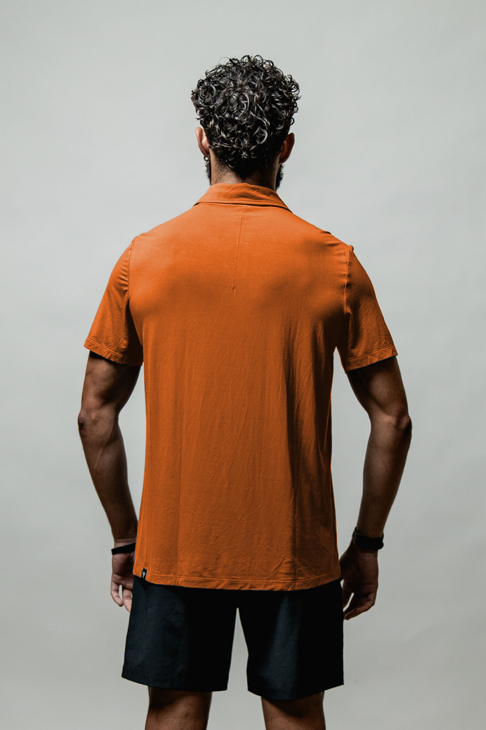 Men's Terra Recovery Polo (Sunfire Clay) Engineered with a structured yet flexible fit