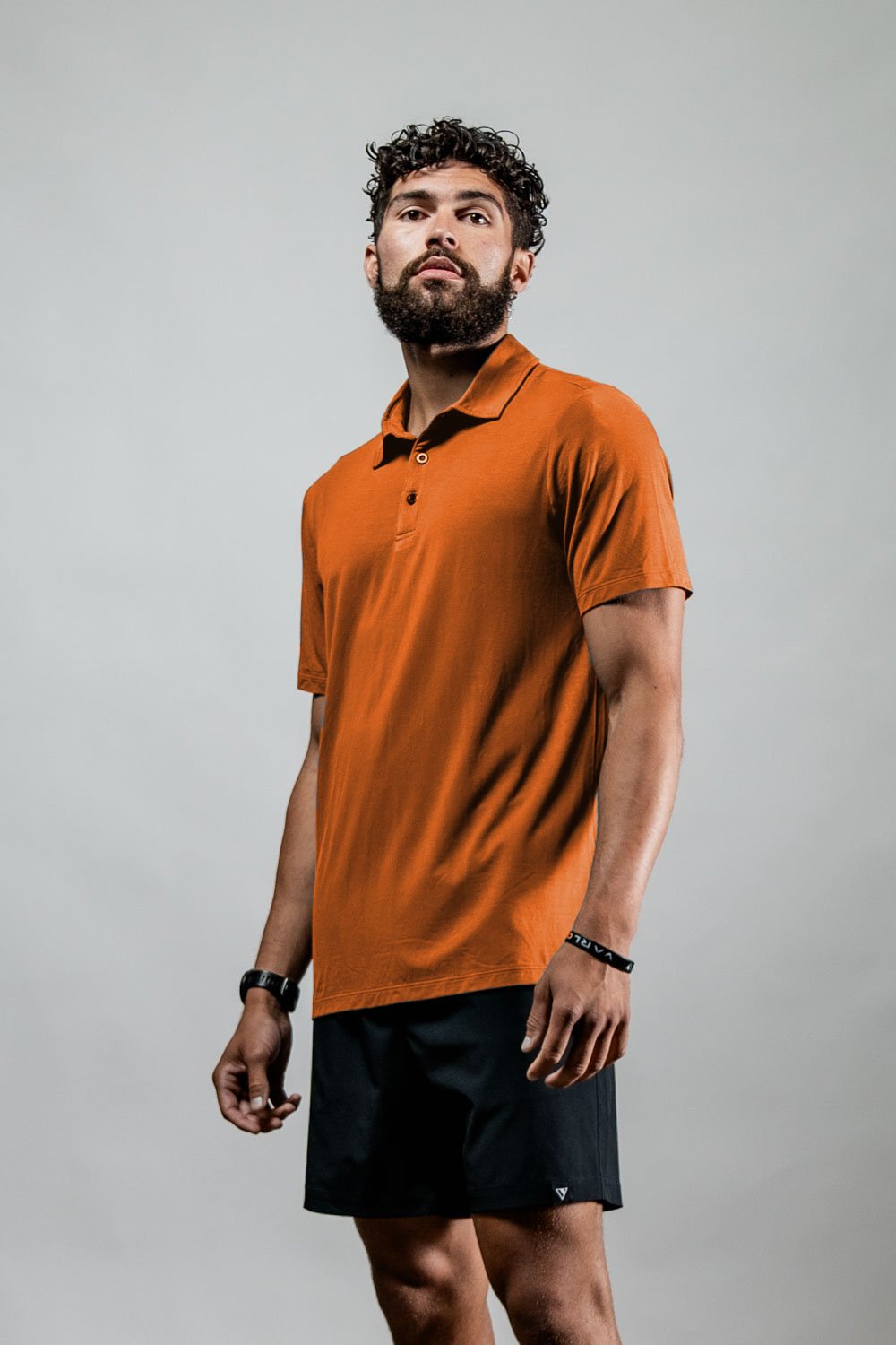 Men's Terra Recovery Polo (Sunfire Clay) Engineered with a structured yet flexible fit