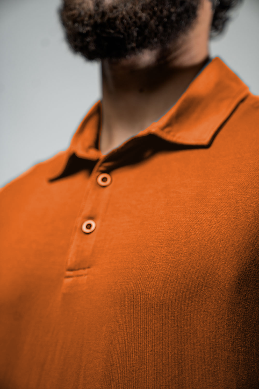 Men's Terra Recovery Polo (Sunfire Clay) Engineered with a structured yet flexible fit